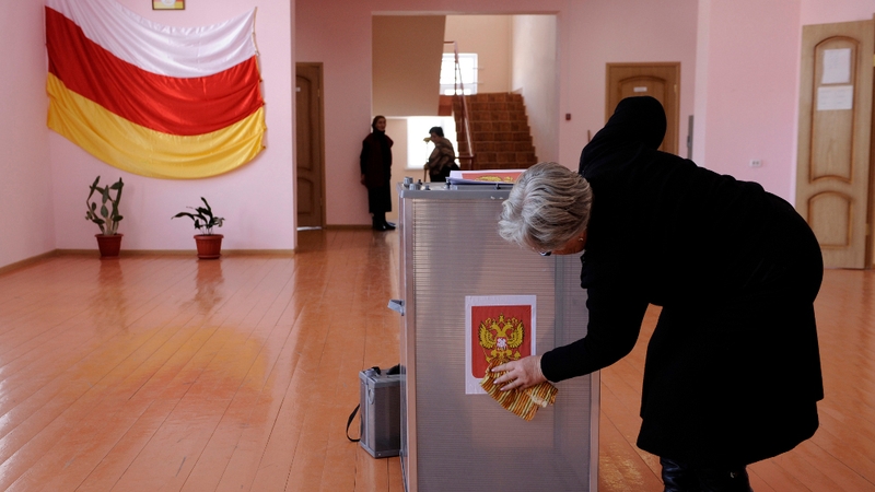A member of a local election commission prepares a polling station in Tskhinvali
