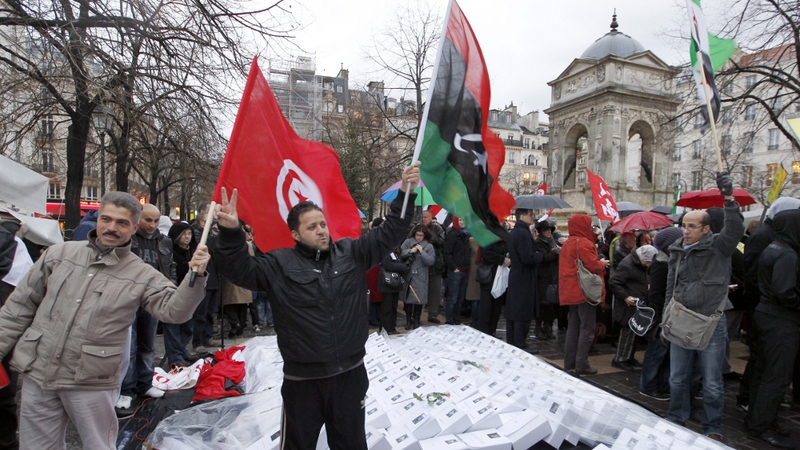 People rally during a demonstration organised by Amnesty International