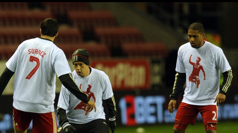 Glen Johnson (right) - the entire Liverpool squad wore Suarez t-shirts during their warm-up on Wednesday