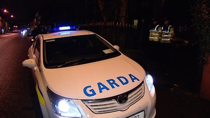 Around a dozen people gathered at a house at Rockgrove Terrace