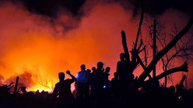 Officials search for surivors following an explosion in Yangon, Burma