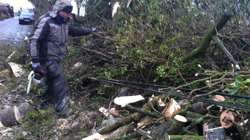 Local farmer Joe Moran clears a fallen tree on the Galway/Mayo border near Shrule