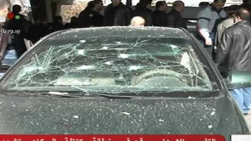 Syrian television showed footage of several damaged cars