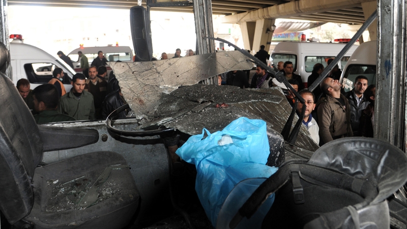 People gather at the site of a powerful explosion that hit the Midan neighbourhood