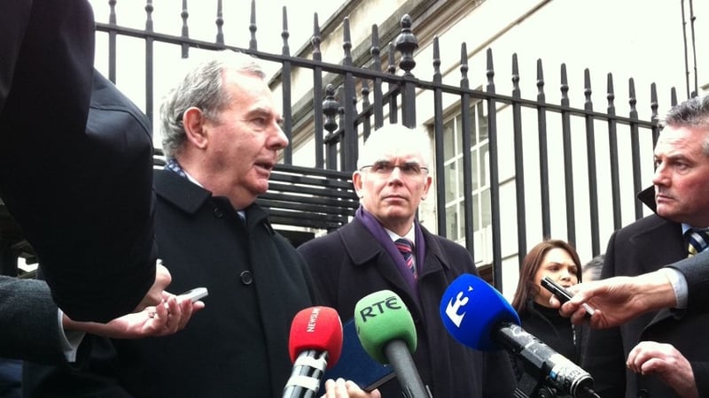 Seán Quinn speaks to reporters outside Belfast High Court today