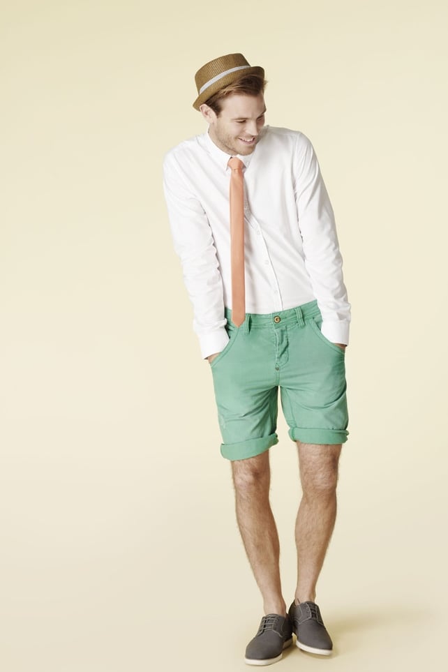 Straw hat €11.99, shirt €17.99, orange tie €7.99, chino shorts €17.99, grey shoes €29.99