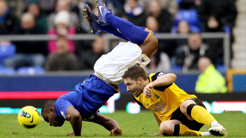 Blackburn Rovers' David Dunn looks on at Victor Anichebe's unique take on the diving header