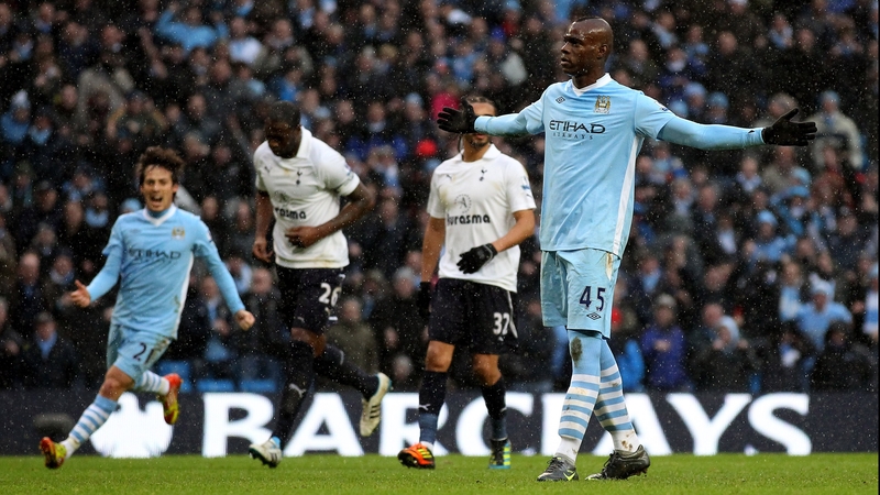 Mario Balotelli celebrates his stoppage-time winner against Spurs