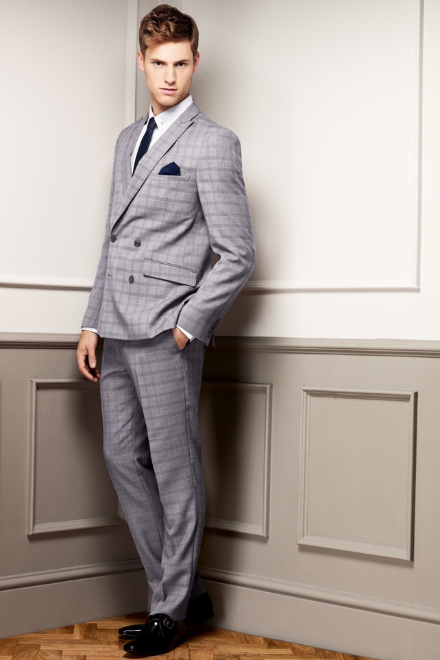A checkered grey, double-brested suit