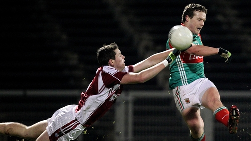 NUIG's David Gavin tries to block Andy Moran's effort at goal