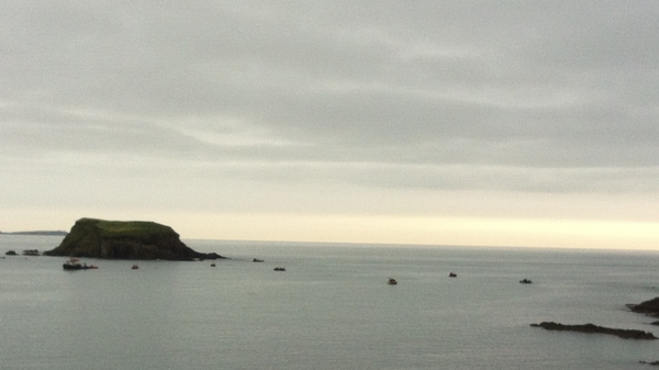 Divers off Adam's Rock continue the search for the missing fishermen