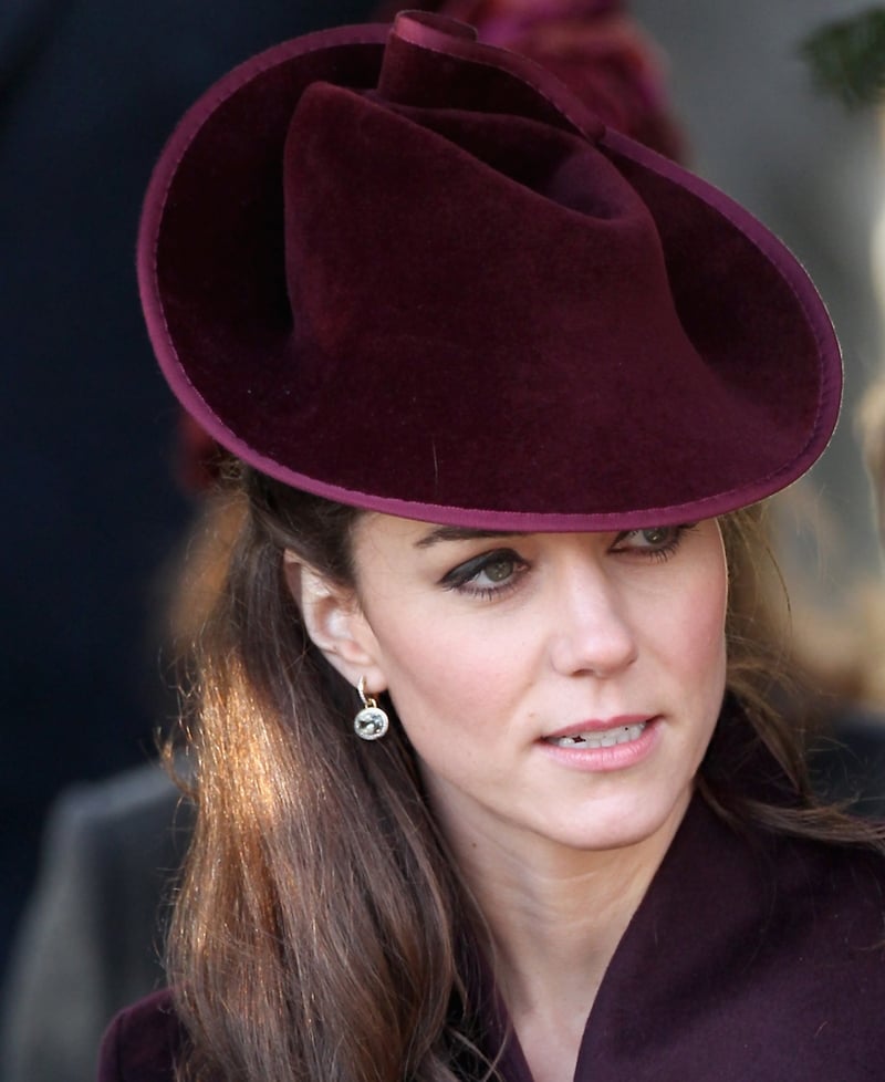 On Christmas morning, wearing a maroon hat to match her dress suit