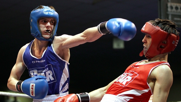 Michael Conlan avoids the punch of Chris Phelan en route to a 19-11 victory