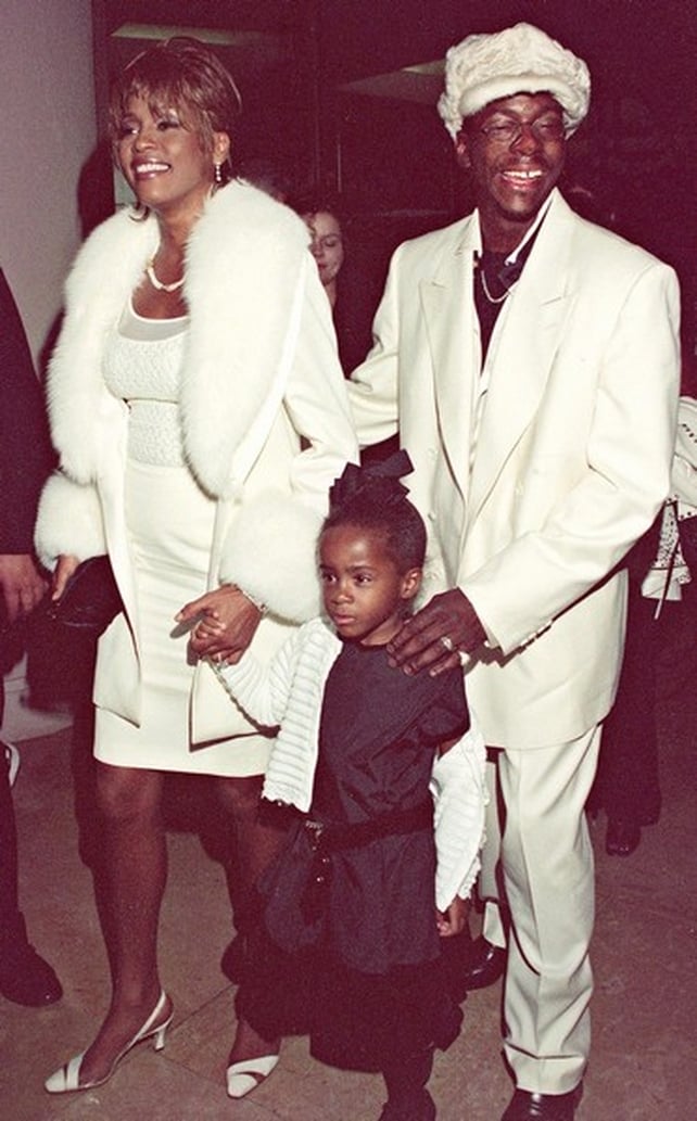 Whitney with Bobby Brown and daughter Bobby Christina in 1998