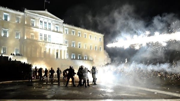 Greek protests grow as parliament backs more austerity measures