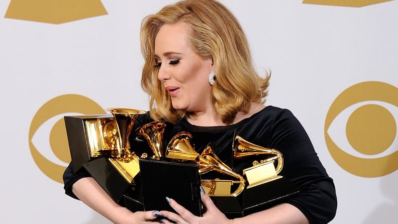 Riding high - the singer cradles her six awards after last weekend's Grammys