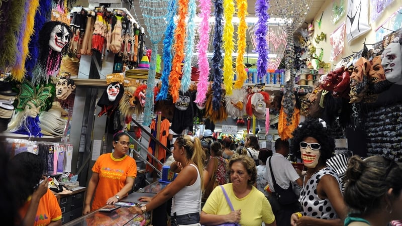 Tourists and locals look for Carnival costumes and accessories in a popular market downtown Rio de Janeiro