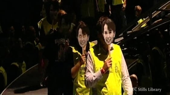 Masks of Aung San Suu Kyi worn by U2 concert goers.