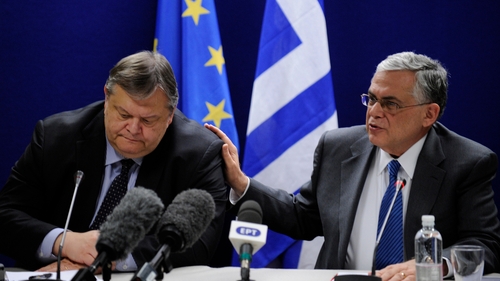 Greek Prime Minister Lucas Papademos (right) said he was "very happy" with the deal