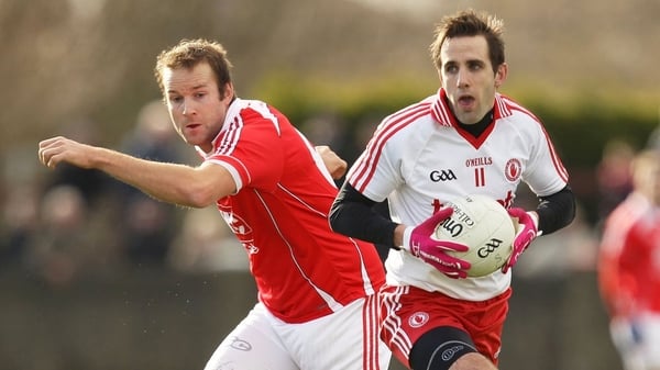Tyrone's Mark Donnelly evades Michael Fanning of Louth