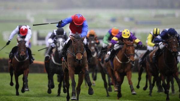 Quevega (red &amp; blue on left) surges clear with Ruby Walsh in the saddle