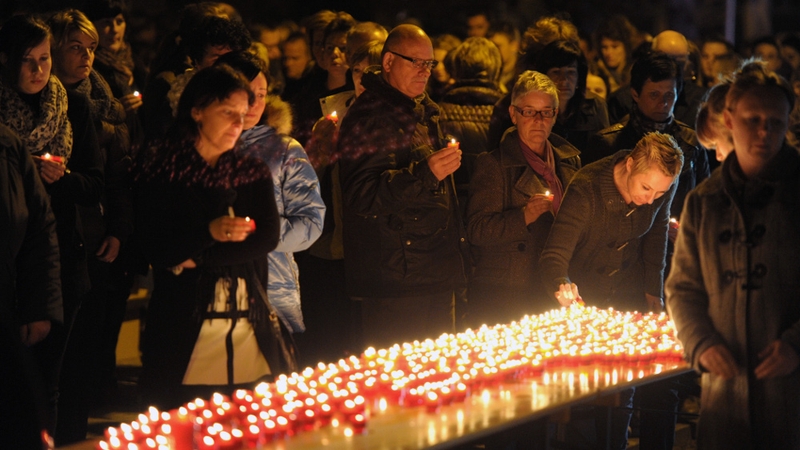 People gather for a remembrance service in Lommel