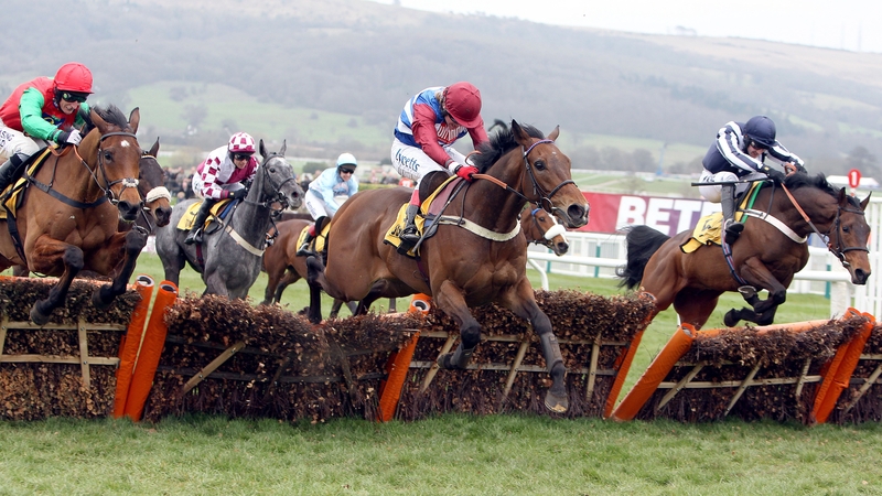 Countrywide Flame ridden by Dougie Costello (right) beats Grumeti ridden by Robert Thornton (middle) to win