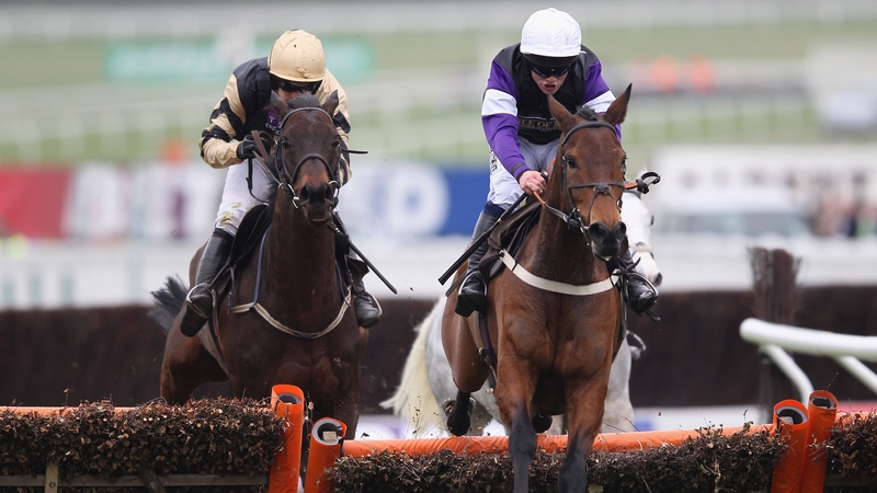 Brindisi Breeze (right), ridden by Campbell Gillies, on his way to victory in the Albert Bartlett Novices' Hurdle as Boston Bob (left), ridden by Ruby Walsh, finishes second