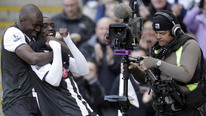 Newcastle's goalscorer Papiss Demba Cisse (c) and Demba Ba celebrate the only goal of the game