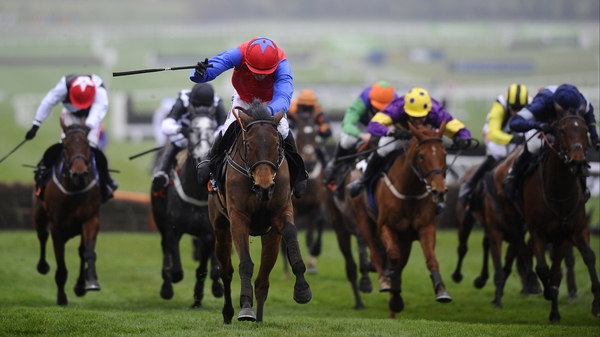 Quevega (blue sleeves) may face World Hurdle runner-up Voler La Vedette at Punchestown