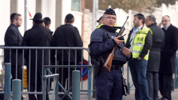 Policemen stand guard in front of the 'Ozar Hatorah' Jewish school in Toulouse