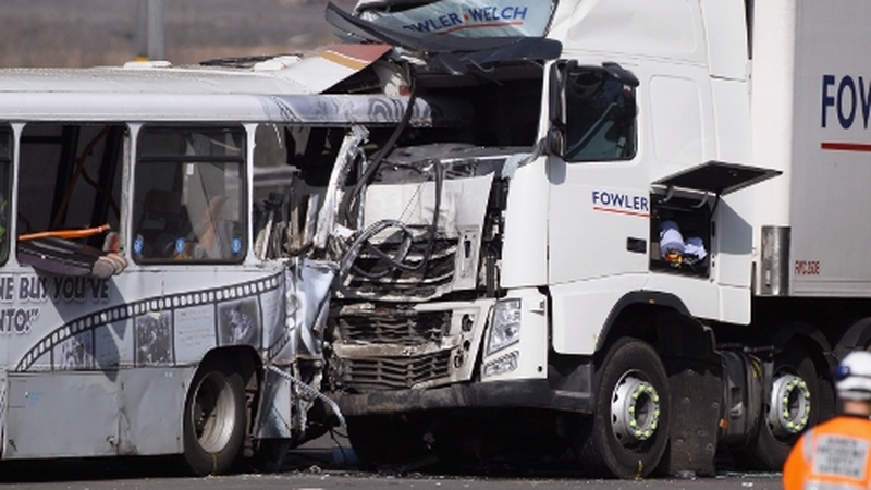 One person was killed after a lorry crashed into a bus in the UK