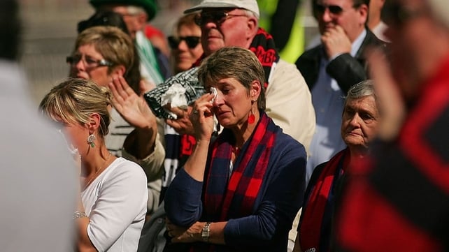 A woman weeps during the funeral