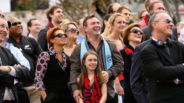 Members of the crowd enjoy a lighter moment during the service