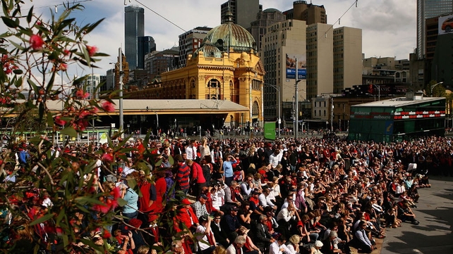 Crowds follow proceedings attentively at Federation Square