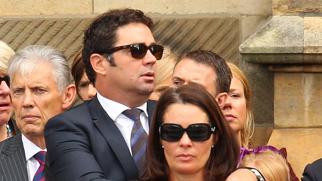 Garry Lyon, who gave one of the eulogies, watches as the coffin leaves St Paul's Cathedral