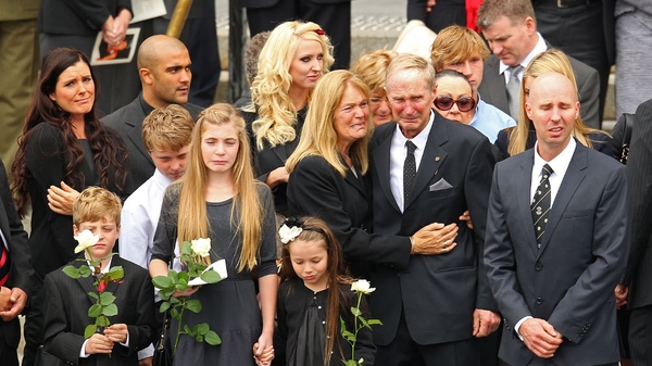 Jim Stynes' coffin is carried from St Paul's Cathedral in Melbourne