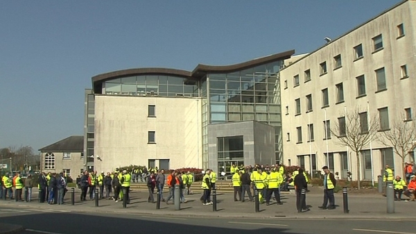 Workers protested outside council offices today