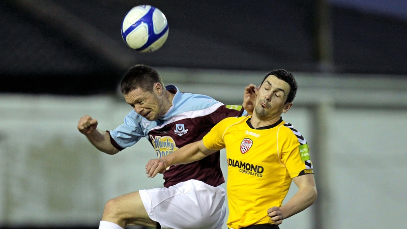 Drogheda's Brian Gannon with Mark Farren of Derry City