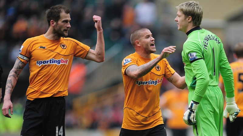 Wayne Hennessey (R) of Wolves squares up to his captain Roger Johnson (L)