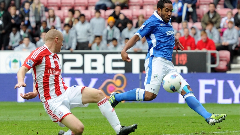 Wigan's Jean Beausejour (R) missed an open goal during the first half