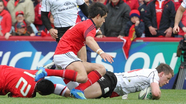 Ulster wing Craig Gilroy crosses for the game's opening try