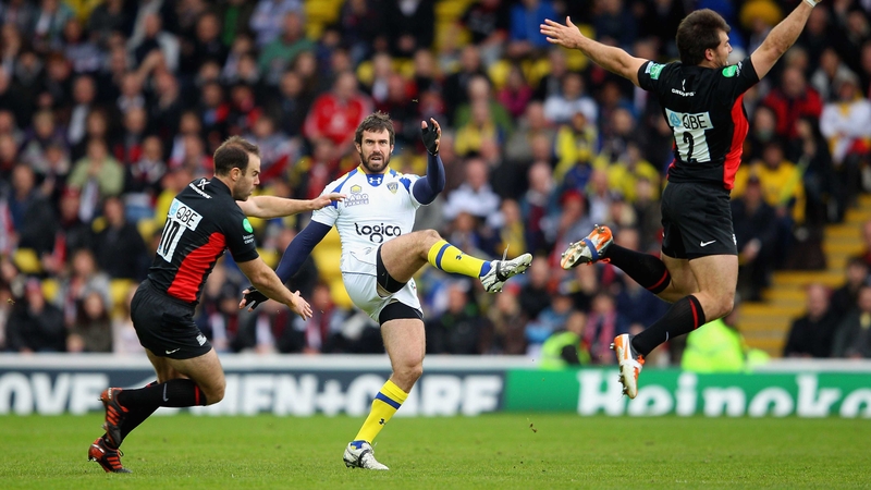 Brock James of Clemont punts the ball upfield