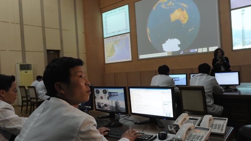 North Korean technicians working at the control room of the Tongchang-ri space centre