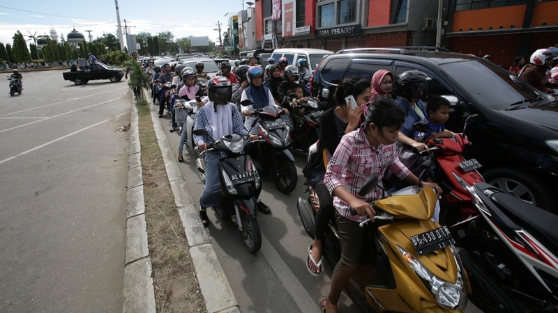 People try to go to higher ground after the powerful earthquake hit
