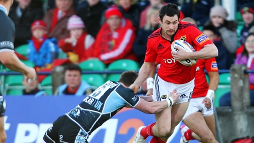Glasgow's Stuart Hogg attempts to halt the run of Munster's Felix Jones