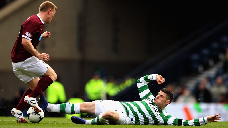 Garry Hooper of Celtic tackles Andy Driver of Hearts during their Scottish Cup semi-final clash