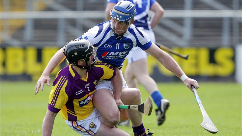 Darren Stamp of Wexford with Willie Hyland of Laois during the Division 1B clash