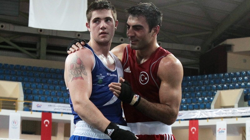 A shell-shocked Joe Ward is consoled by a jubilant Bahran Muzaffer