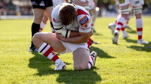 Paul Marshall grasps his elbow after injuring it while scoring a try against Connacht